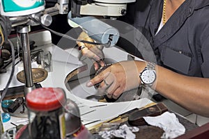 Goldsmith at work with traditional tools