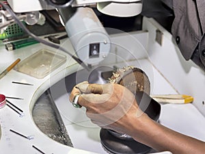 Goldsmith at work with traditional tools