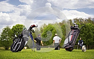 Golf bags with group of players