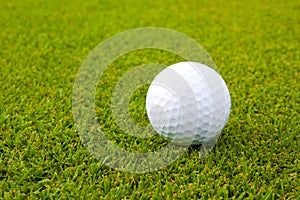 Golf ball on green grass