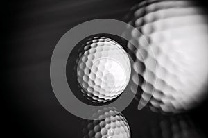 Golf ball on black background