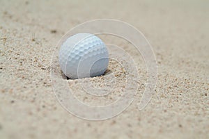 Golf-ball in bunker photo