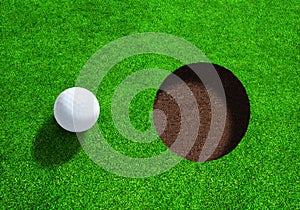 Golf Ball Close to Hole With Copy Space