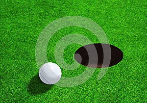 Golf Ball Close to Hole With Copy Space
