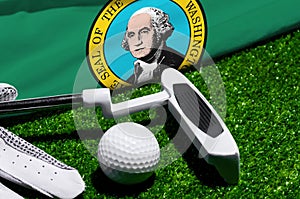 Golf ball and club with flag of Washington on green grass. Golf championship in Washington