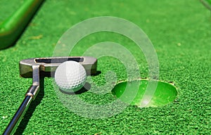 Golf ball and Golf Club on Artificial Grass