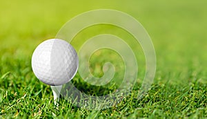 Golf ball on grass in green background. Banner for advertising with copy space.