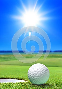 Golf ball on green course