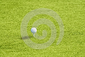 Golf ball on the green grass