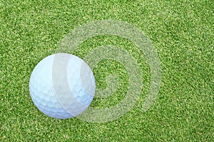 Golf ball on the green grass