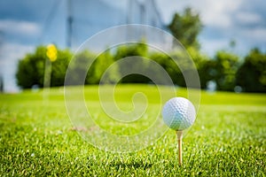 Golf ball on golf green grass natural fairway
