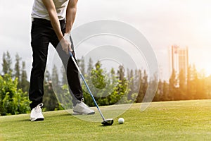 Golf ball on green grass ready to be struck at golf club