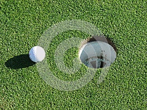 Golf ball and hole