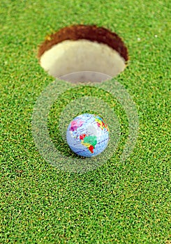 Golf ball in the hole, golf in the world photo