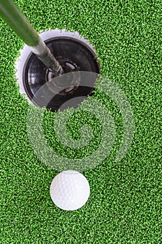 Golf ball and hole