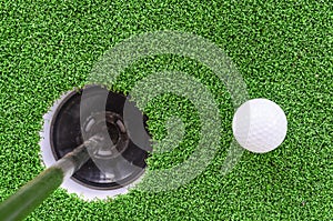 Golf ball and hole