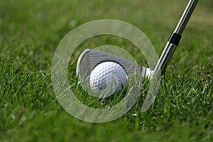 Golf ball iron grass