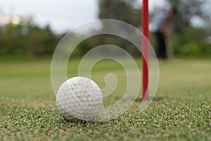 Golf ball lip of hole on green