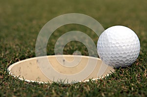 Golf Ball near the cup