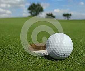 Golf ball near hole