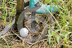 Golf ball near the tab water pipe