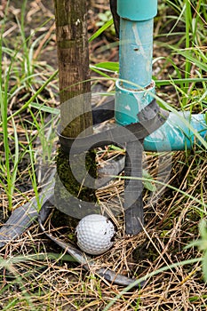 Golf ball near the tab water pipe
