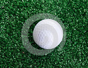 Golf ball ower green grass