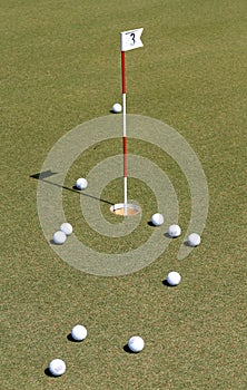 Golf ball on practice green.