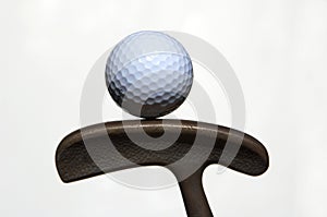 Golf ball and putter photo