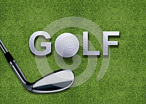 Golf ball and putter on green grass photo