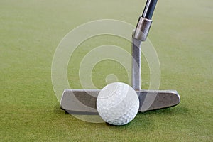 Golf ball with putter