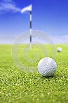 Golf ball on putting green