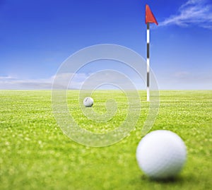 Golf ball on putting green