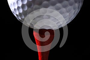 Golf Ball on Red Tee