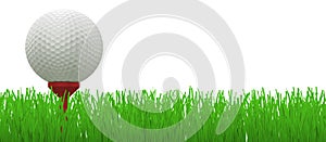 Golf ball on red tee in grass -