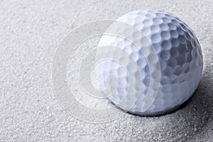 Golf ball in sand trap
