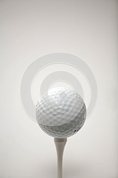 Golf ball on a tee.