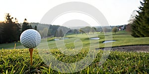Golf ball on tee at the course