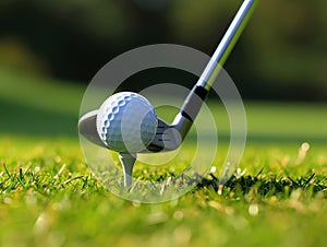 Golf ball on tee with golf club on golf course