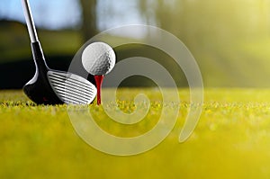 Golf ball on tee with driver