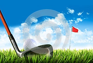 Golf ball with tee in the grass