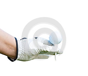 Golf ball with tee in the hand of a golfer isolated on white background