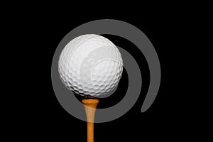Golf Ball on Tee-Peg on black background