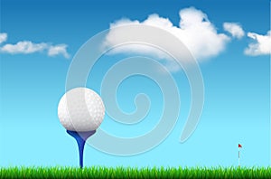 Golf ball on tee under blue sky with clouds