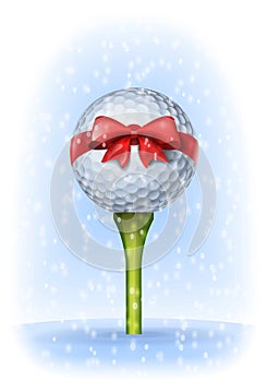 Golf ball tied with a red bow on tee