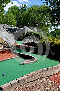 Golf Ball on Winding Miniature Golf Course Hole
