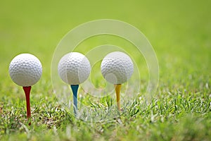 Golf ball on wooden golf tee.