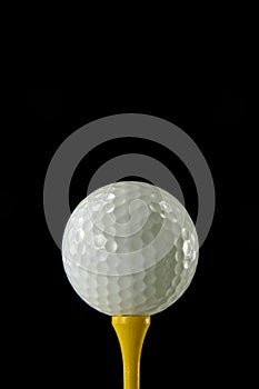 Golf Ball on Yellow Tee