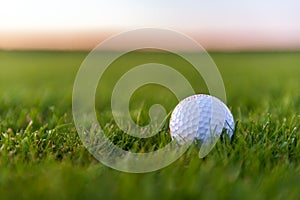 Golf balls on artificial grass with blur background.