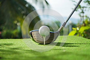 Golf balls on the golf course with golf clubs ready for golf in the first short.